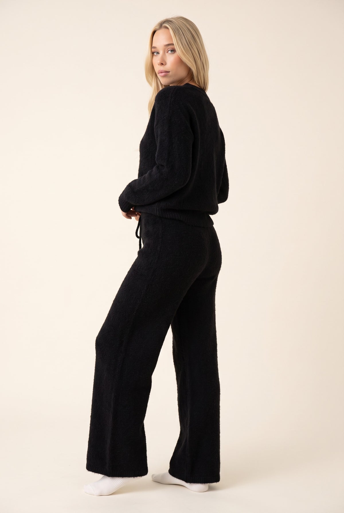 Black cashmere trousers, over the shoulder