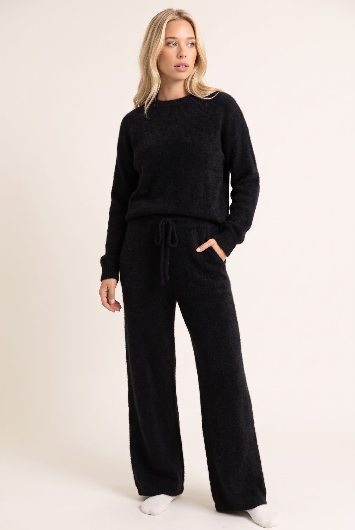 Black cashmere trousers, standing