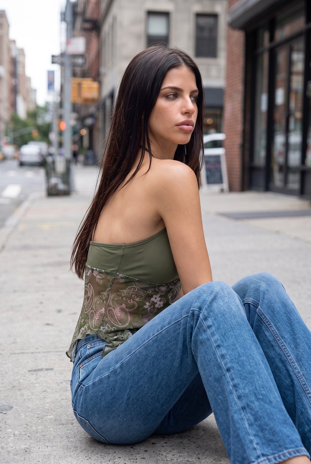 Green printed halter top, seated