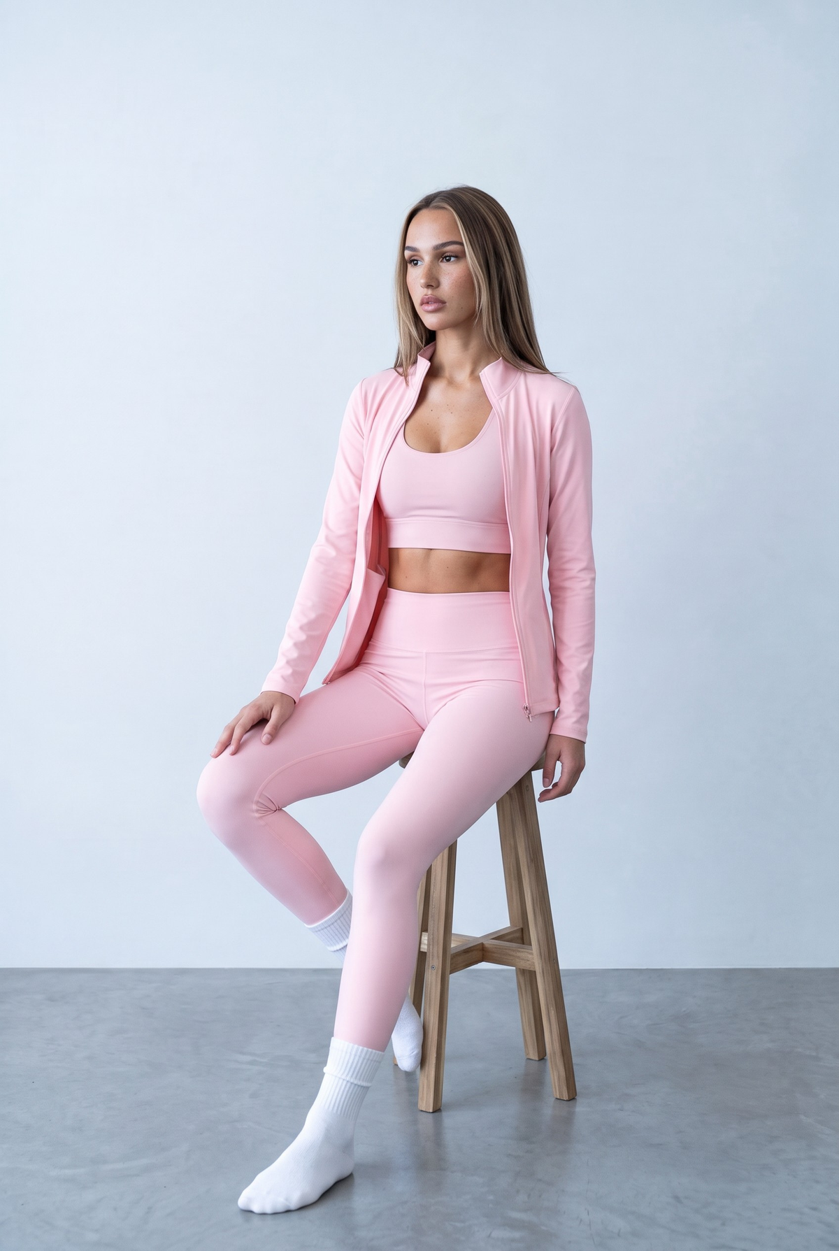 Peach sports set, seated on stool